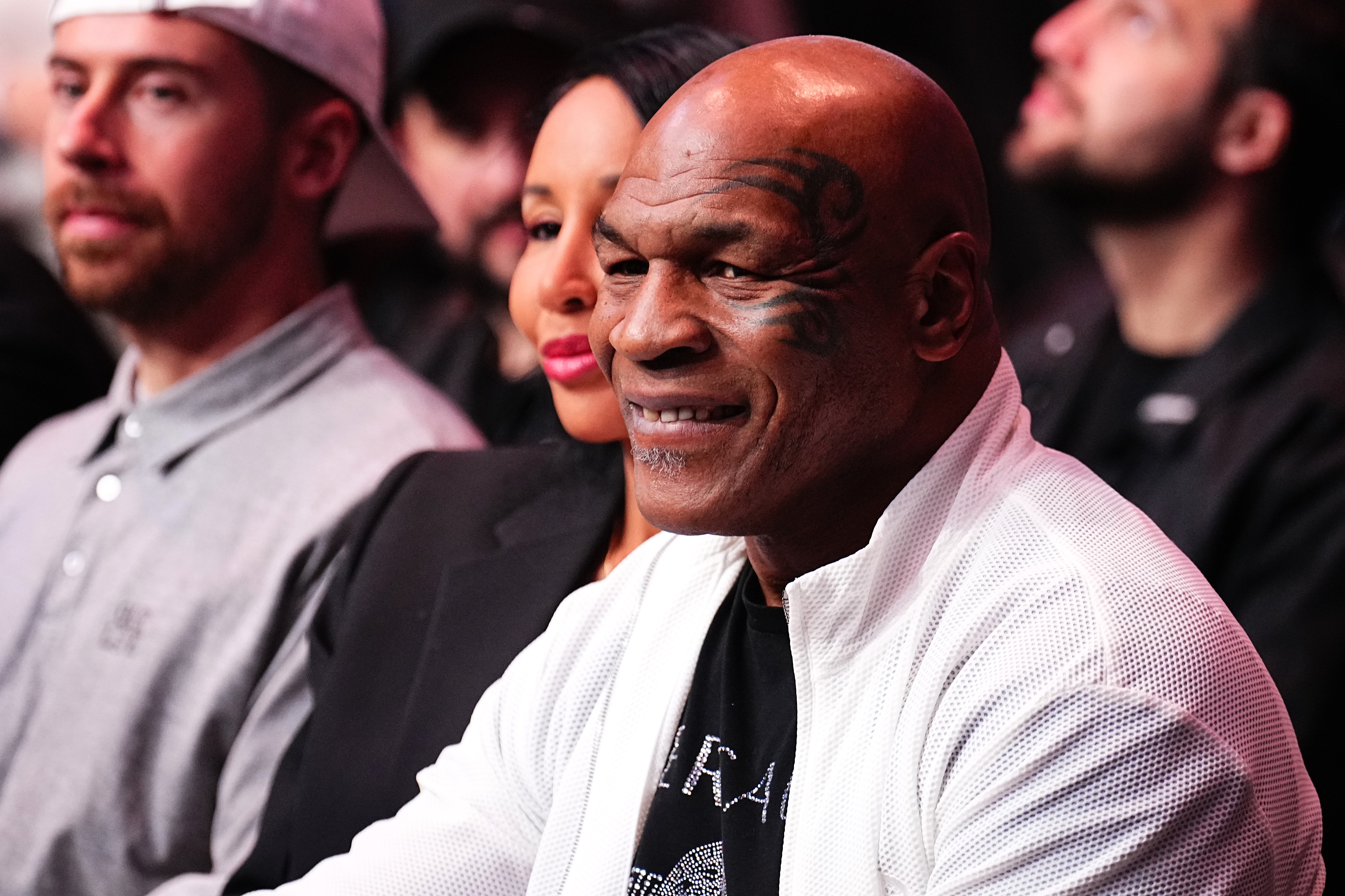 Mike Tyson beamed from cageside at UFC 300