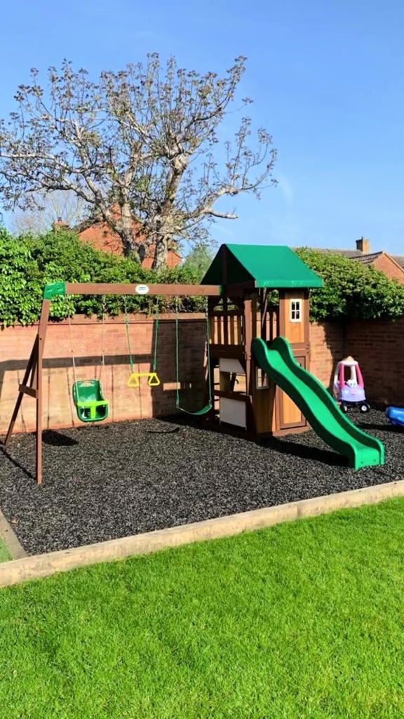 Emily transformed the wasted space into an epic area for the kids using a Costco play set