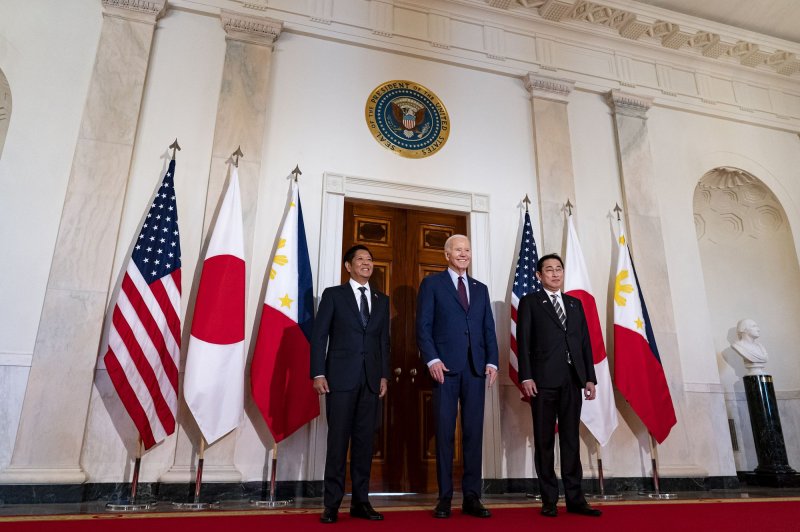 President Joe Biden stands with Philippines President Ferdinand Marcos Jr., left, and Japanese Prime Minister Fumio Kishida during a trilateral meeting in the East Room of the White House. Biden unveiled joint military patrols and training with the Philippines and Japan as the allies seek to counter an increasingly assertive China in the South China Sea. Photo by Al Drago/UPI