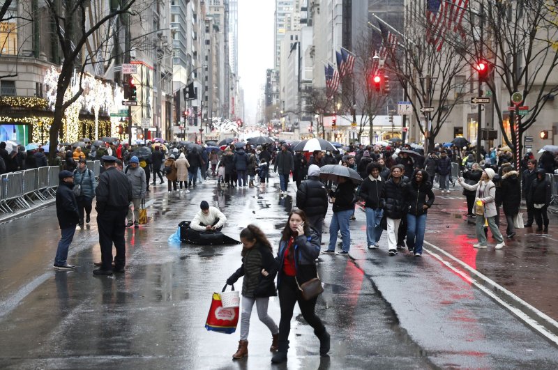 Pedestrians and shoppers walk on Fifth Avenue which is closed to automobile traffic by the NYPD on December 11, 2022 in New York City. Retail sales in March jumped 0.7% beating Wall Street estimates. File Photo by John Angelillo/UPI