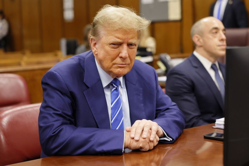 Former President Donald Trump awaits the start of criminal proceedings on the second day of jury selection at Manhattan criminal court in New York on Tuesday, April 16, 2024. Trump is facing 34 felony criminal charges alleging he falsified business records to cover up a sex scandal during the 2016 campaign. Pool Photo by Michael M. Santiago/UPI