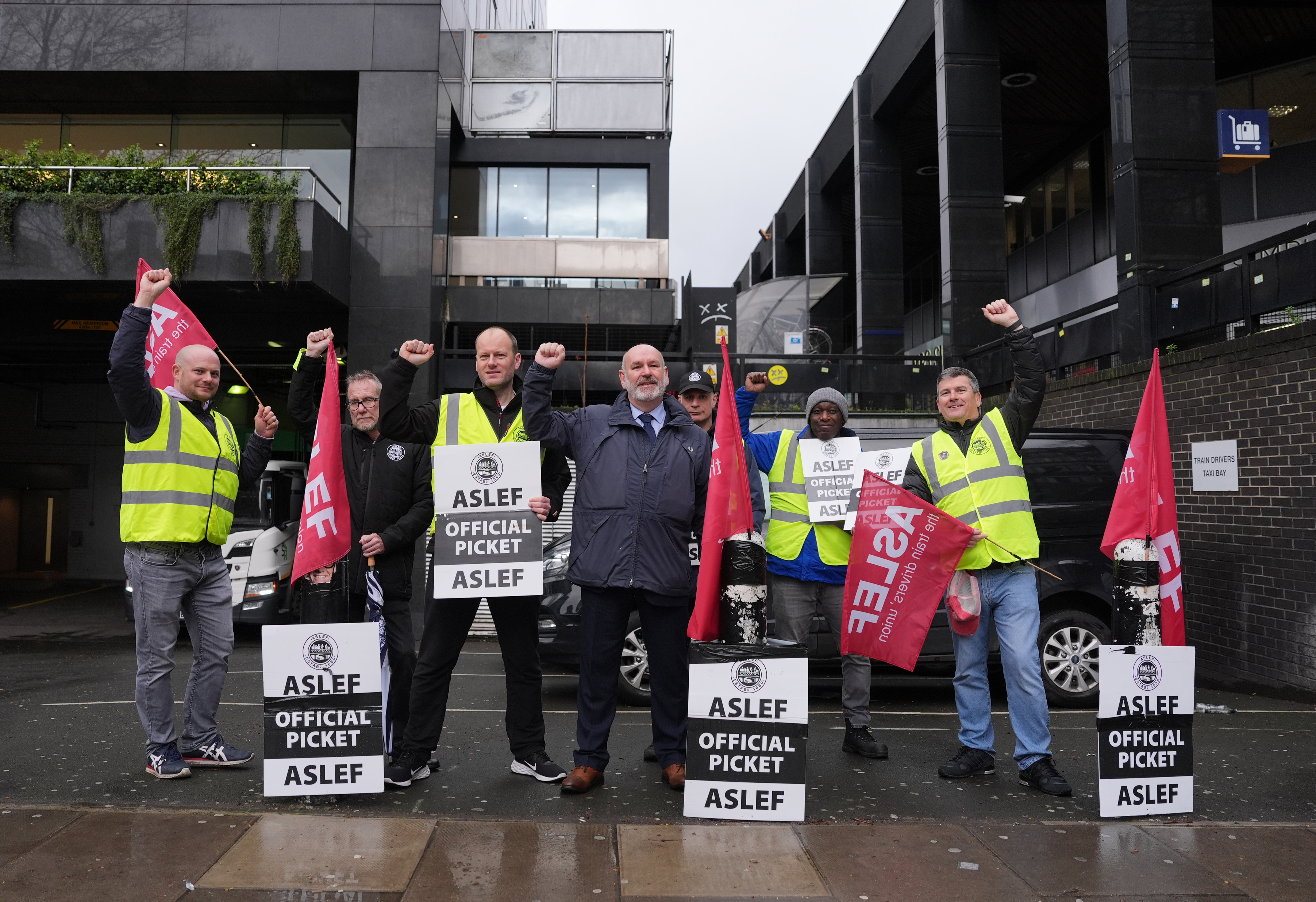 Militant union boss Mick  Whelan, centre, on a picket line at Euston yesterday