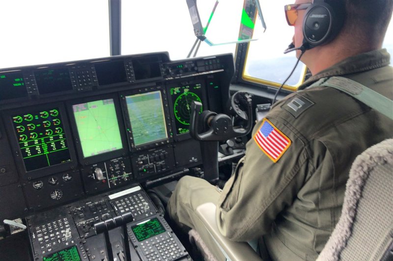 Crewmembers aboard a U.S Coast Guard HC-130 Hercules airplane, which aided in the search for three missing men found stranded on Pikelot Atoll. Photo by Petty Officer 1st Class Amber Howie/EPA-EFE