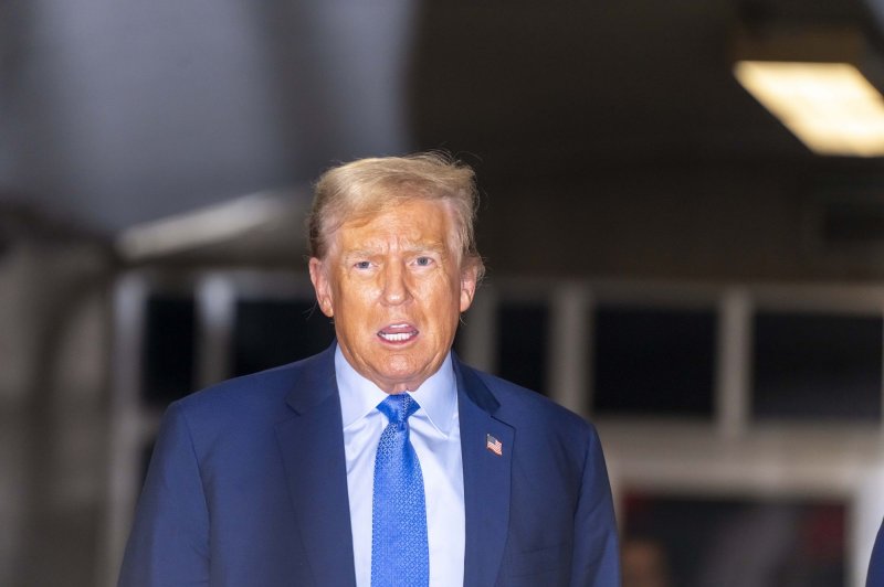 Former President Donald Trump addresses the press as he leaves court in New York on Friday afternoon at the end of week two of his criminal trial on charges he falsified business records to cover up a sex scandal during the 2016 presidential campaign. Pool photo by Mark Peterson/UPI