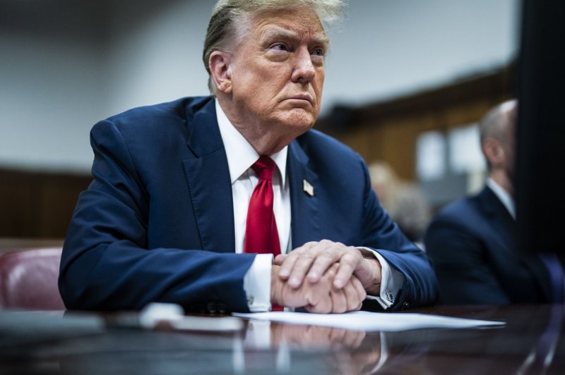 Former President Donald Trump sits in the courtroom on the first day of his criminal hush-money trial in New York on Monday. Trump returns to court Thursday, following a one-day break, as jury selection resumes. Opening statements are expected to begin next week. Pool Photo by Jabin Botsford/UPI