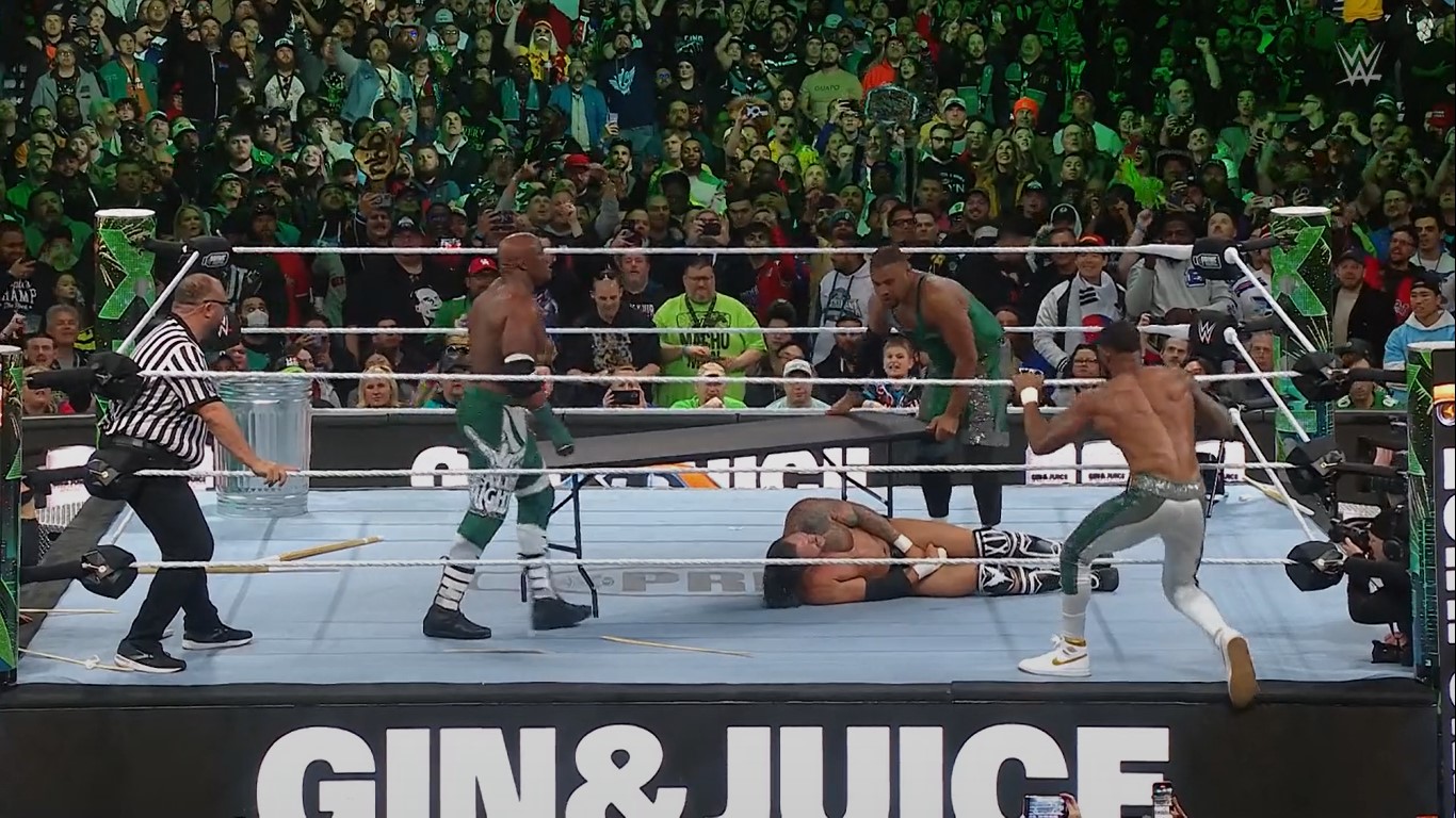 Bobby Lashley and The Street Profits introduced a table to take out Karrion Kross