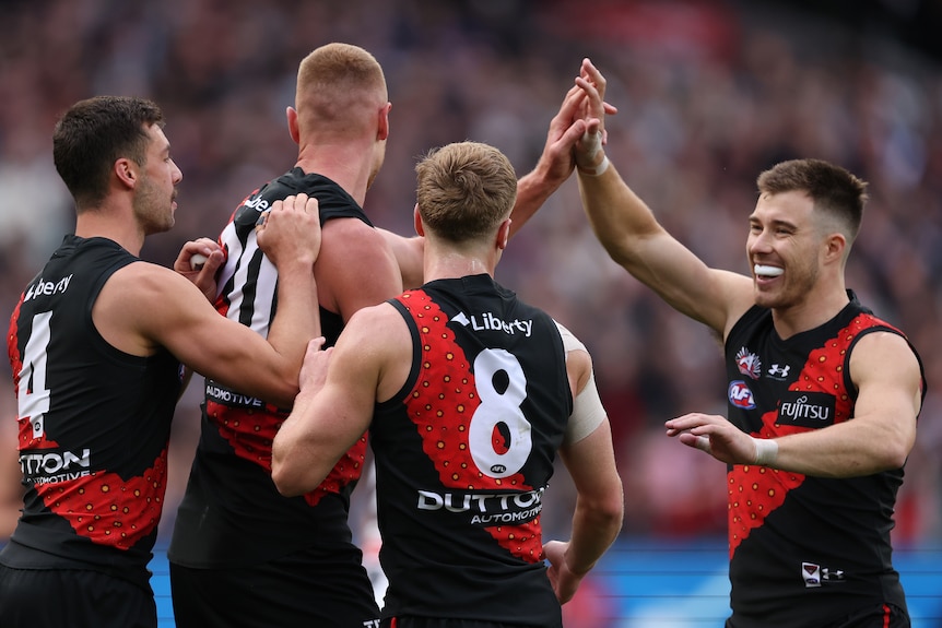 Essendon players celebrating