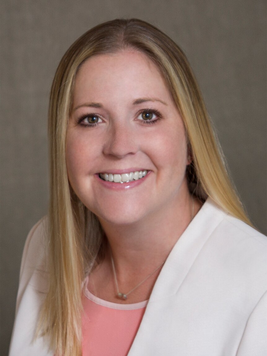 Ellen Klem smiles in a portrait styled headshot