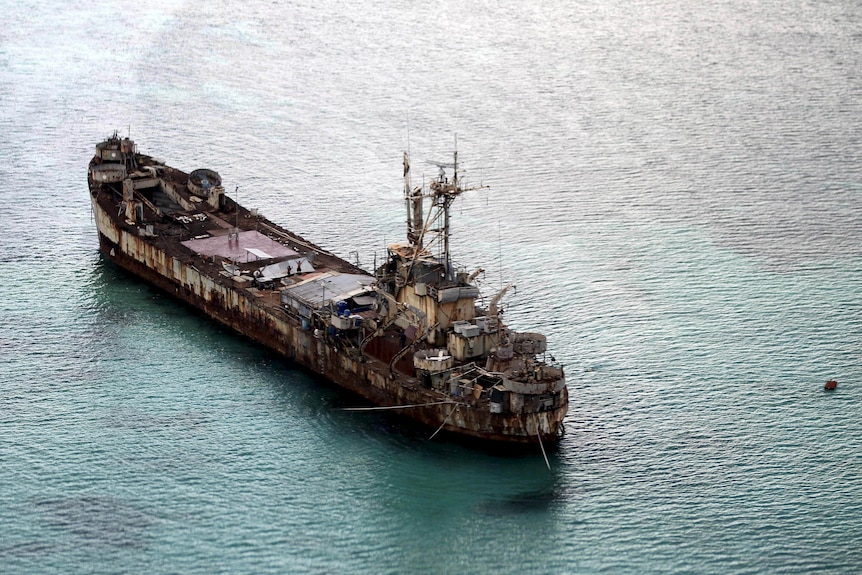 An aerial shot of a dilapidated old warship. 