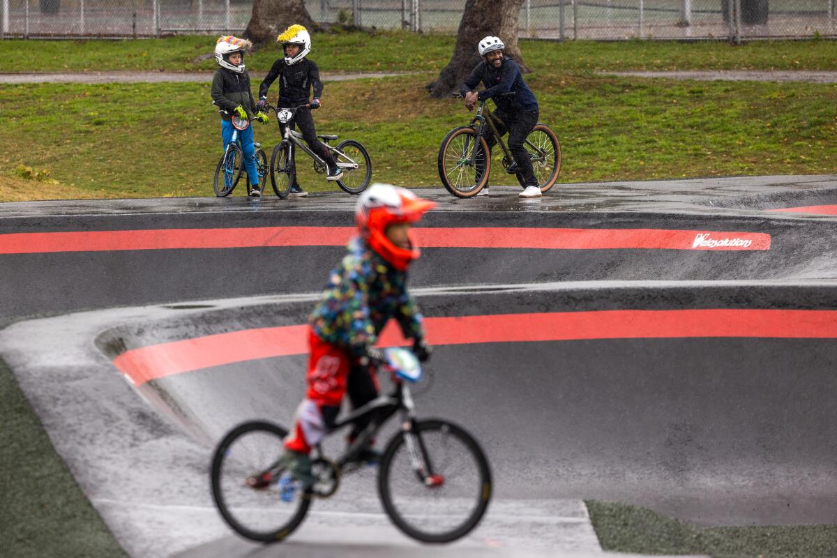 Eliot Jackson rides the Inglewood Pumptrack with pro BMX riders Ameri de Vera and her sister Vida de Vera. 