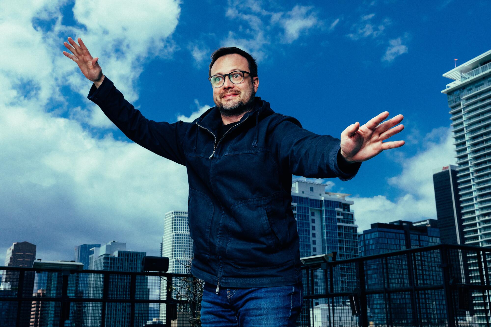 Meow Wolf’s Sean Di Ianni in front of the downtown Los Angeles skyline. 