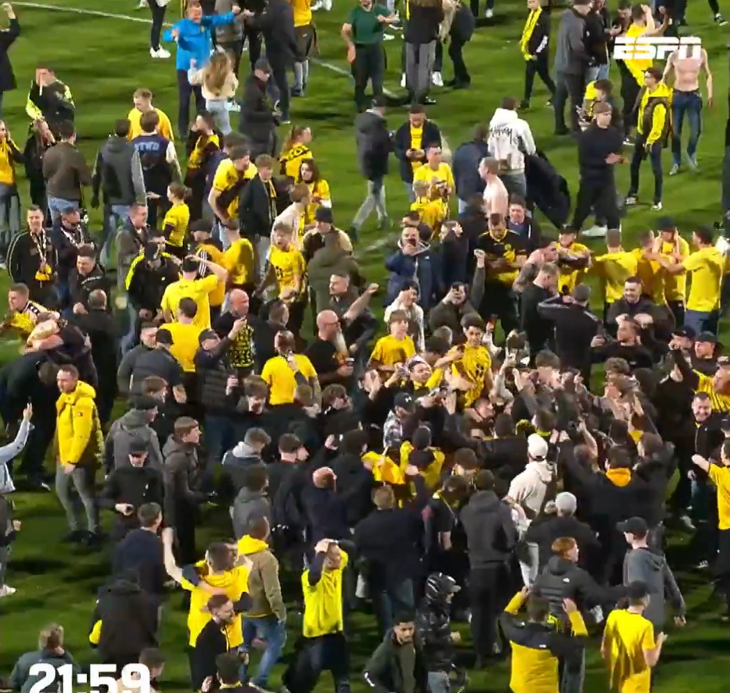 Fans invaded the pitch to celebrate with players