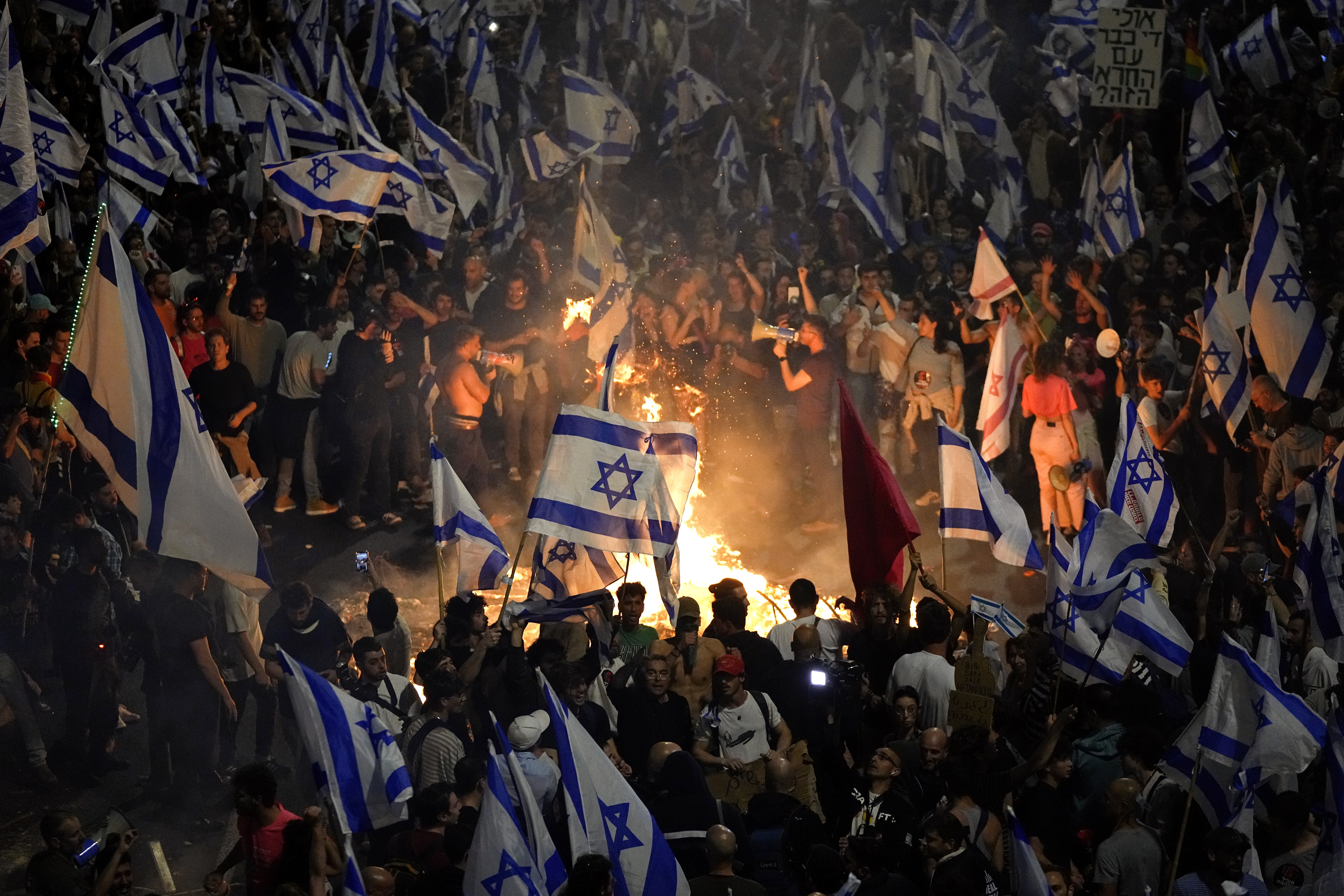 Israelis opposed to PM Benjamin Netanyahu’s judicial overhaul plan set up bonfires and block a highway during a protest