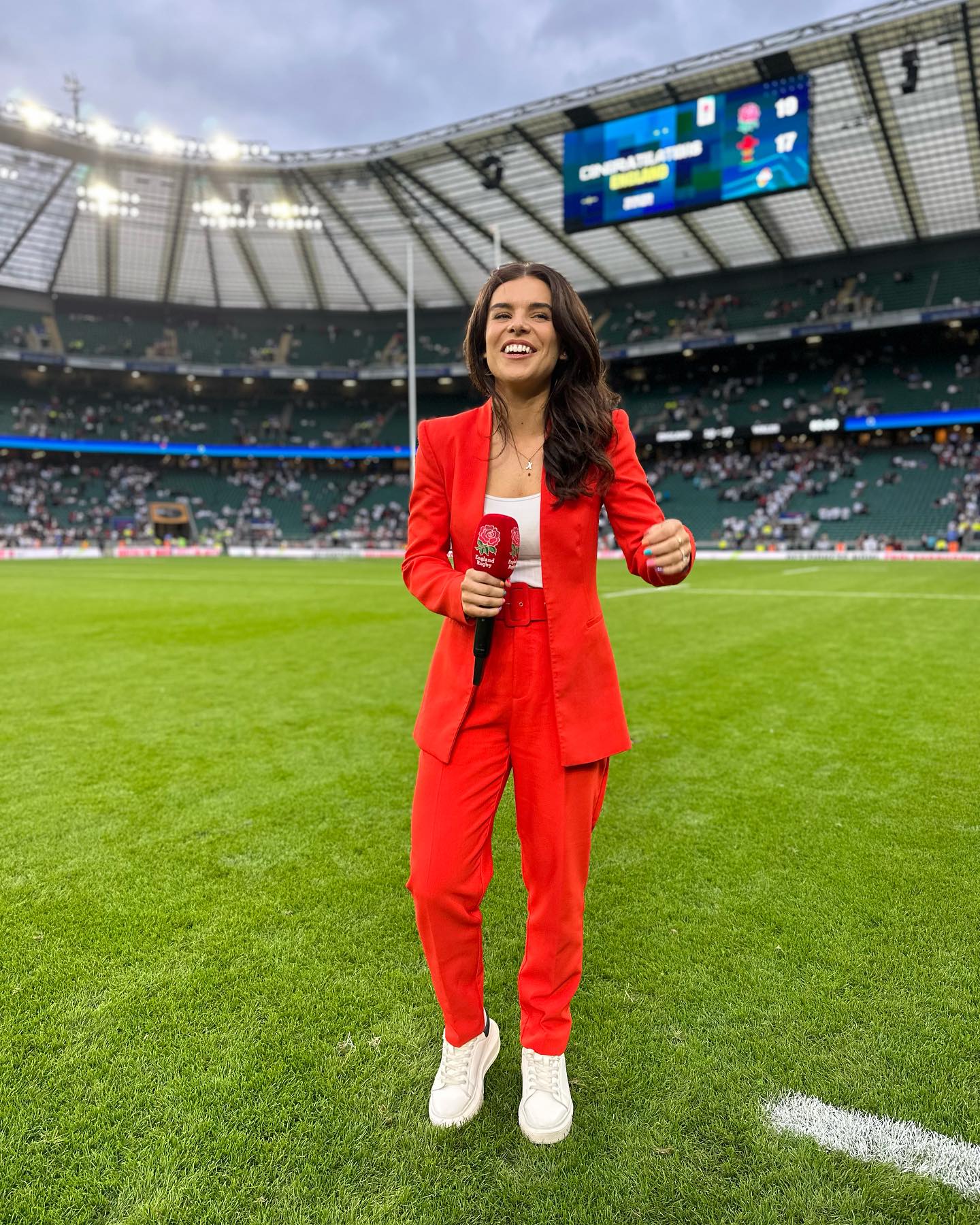 Benali rocked a red suit to cover England rugby - nicknamed the Red Rose