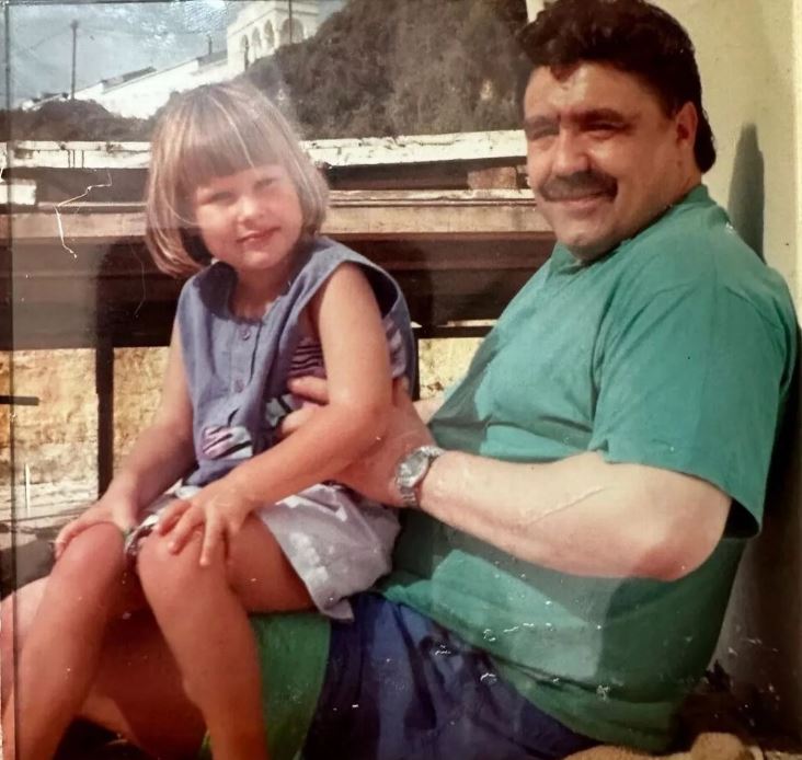 Alan holding the Sophie when she was a child