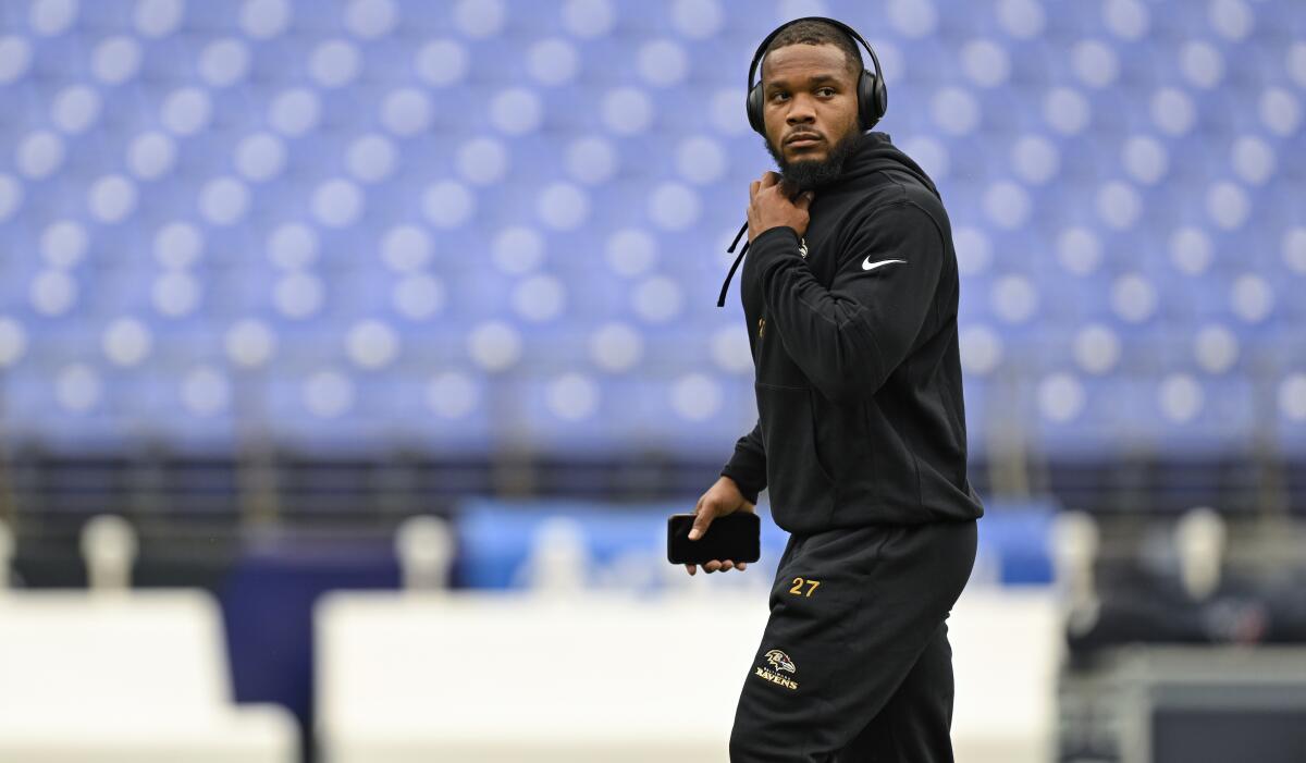 J.K. Dobbins looks on during pre-game warm-ups. 