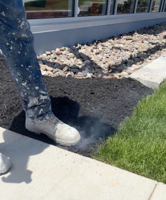 A man stomped on heated mulch to prevent it from catching on fire