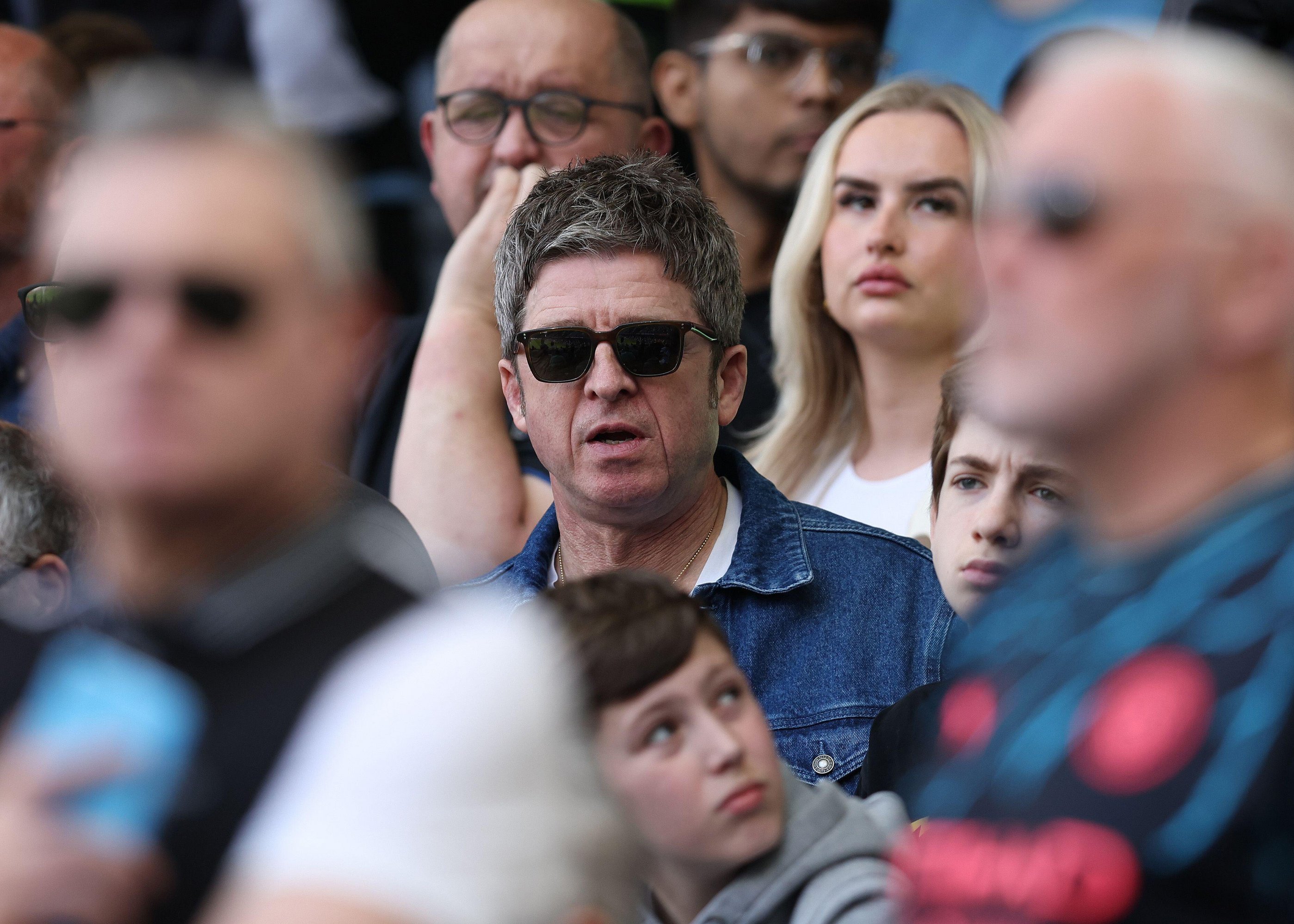 The singer was amongst the travelling fans in the Craven Cottage away end