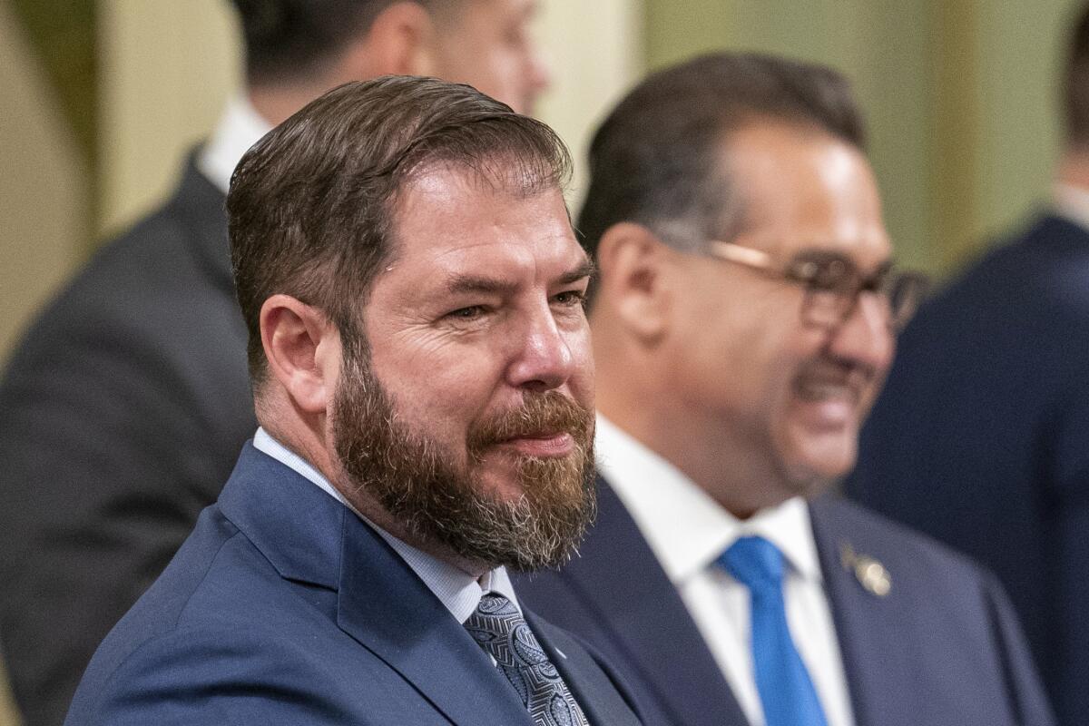 State Assemblymember Joaquin Arambula at the Capitol with other people behind him.