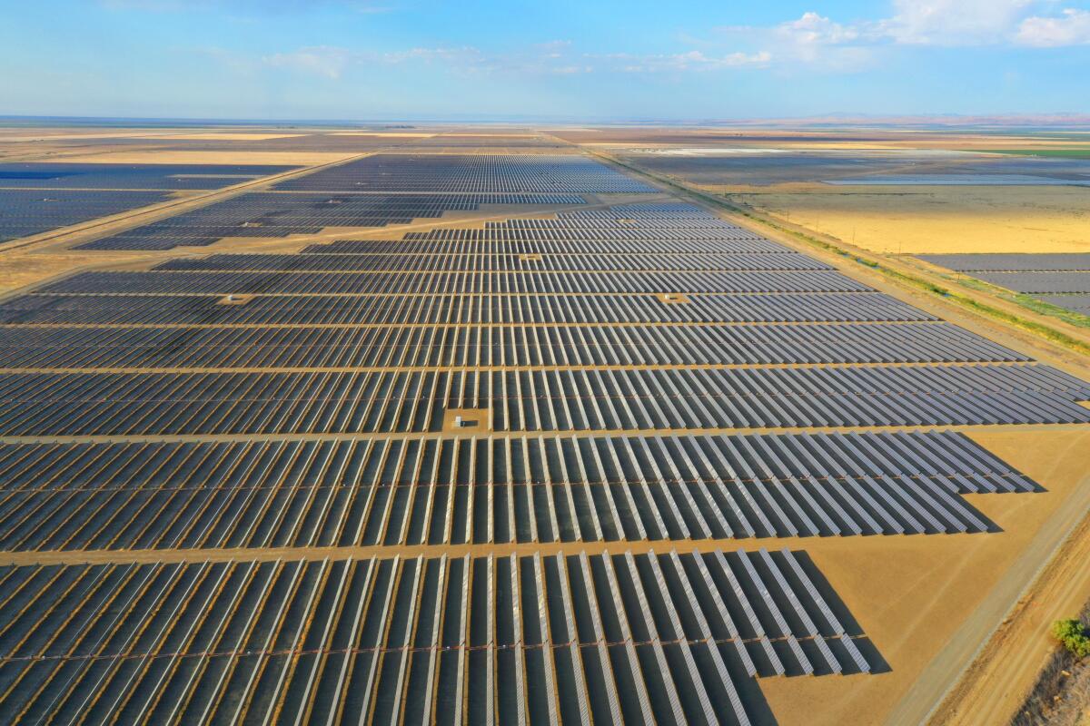 An aerial view of a vast solar park.