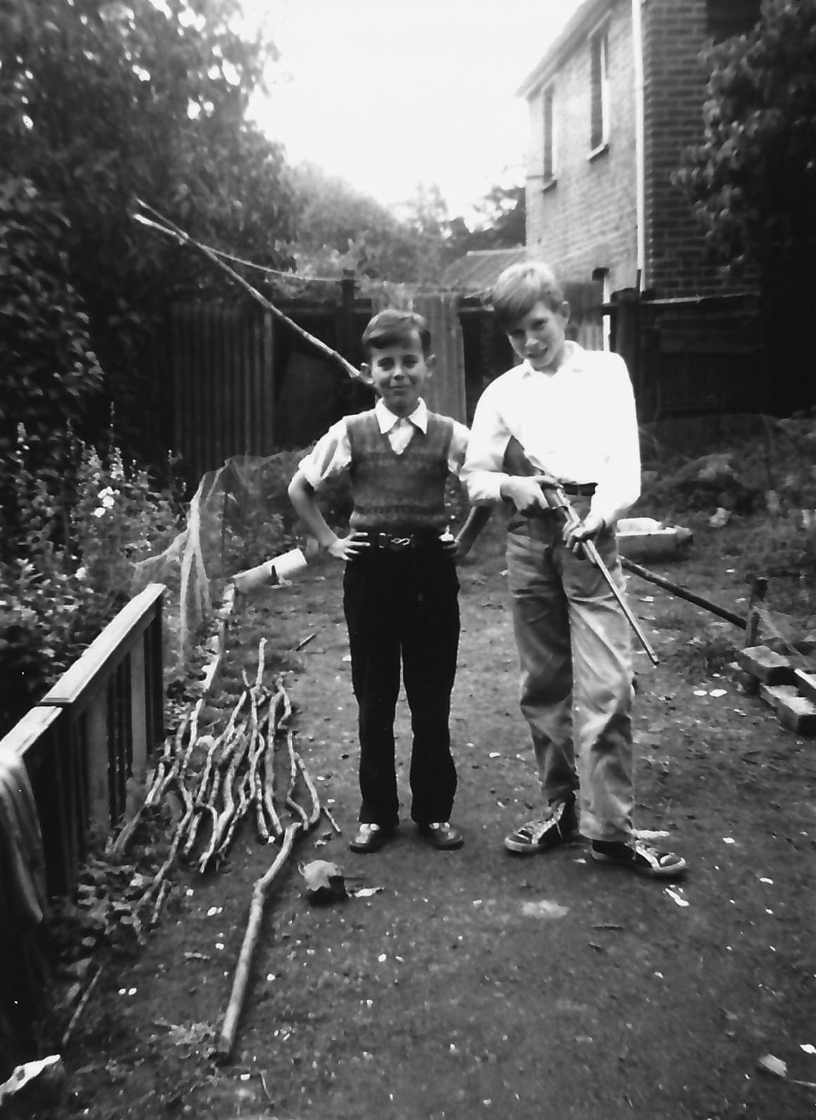 Young Ronnie as a child (right) holding a gun