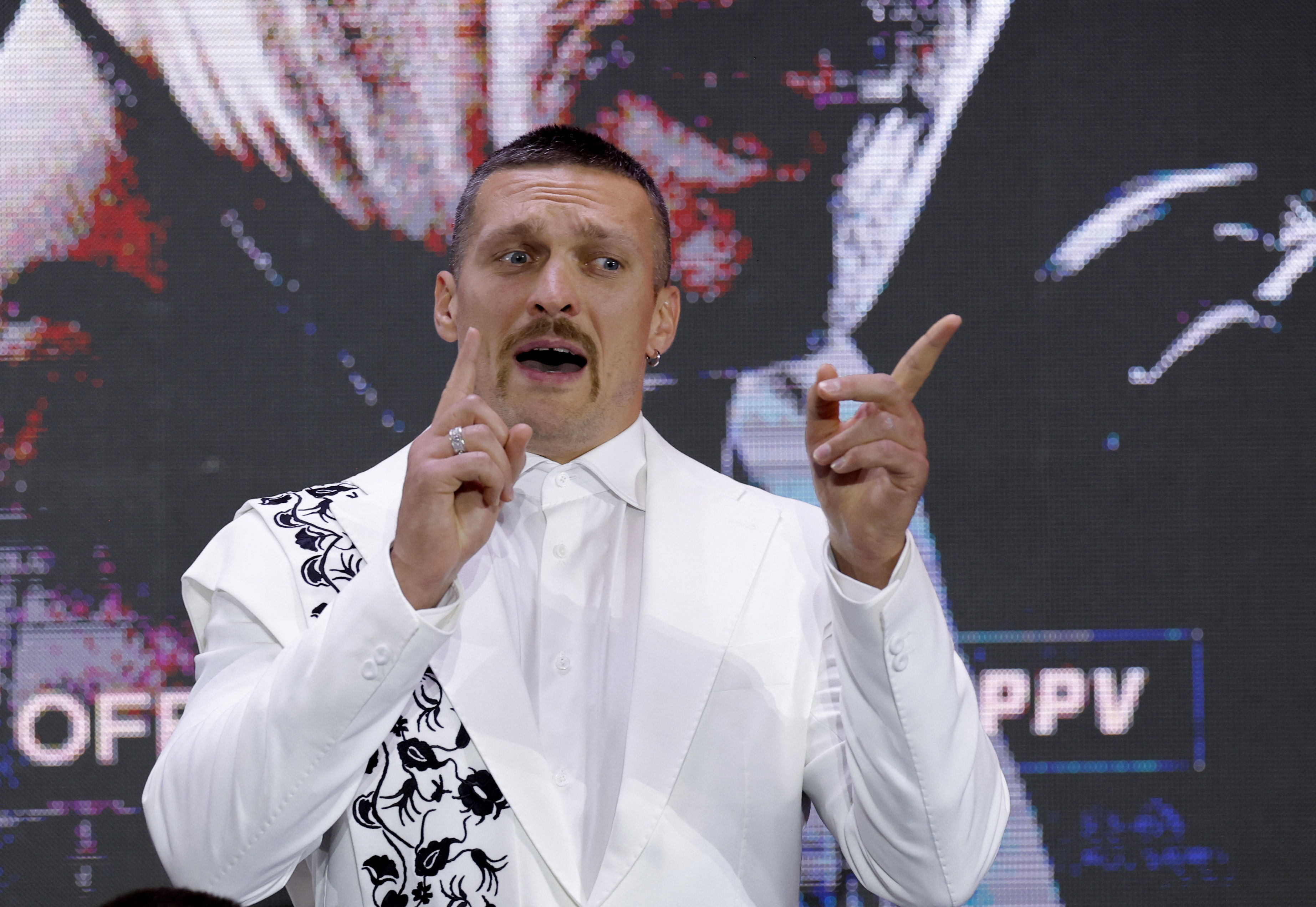 Usyk tried to look confident throughout