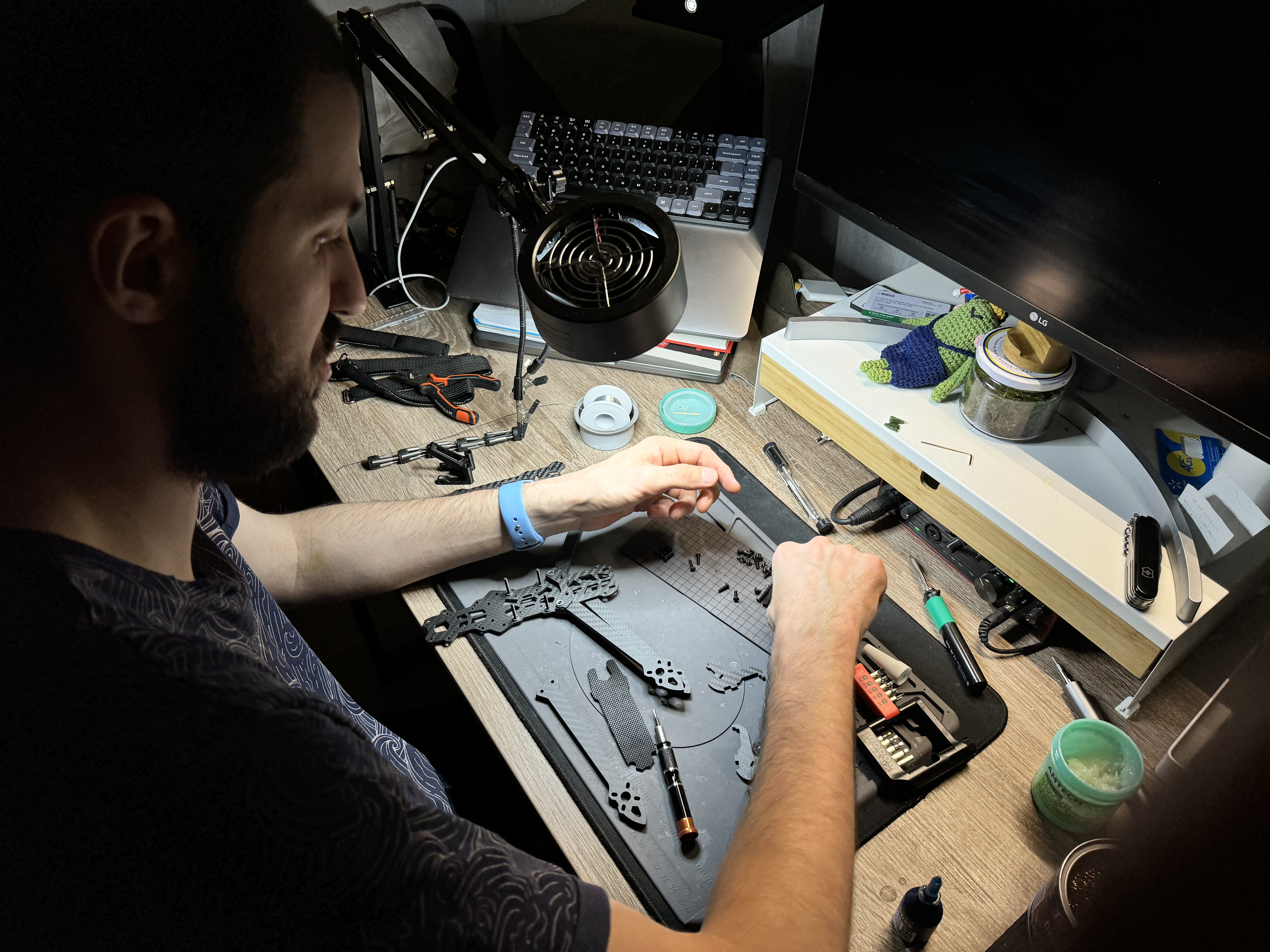 Another volunteer Mykhailo Torolchuk hard at work assembling FPVs in his bedroom