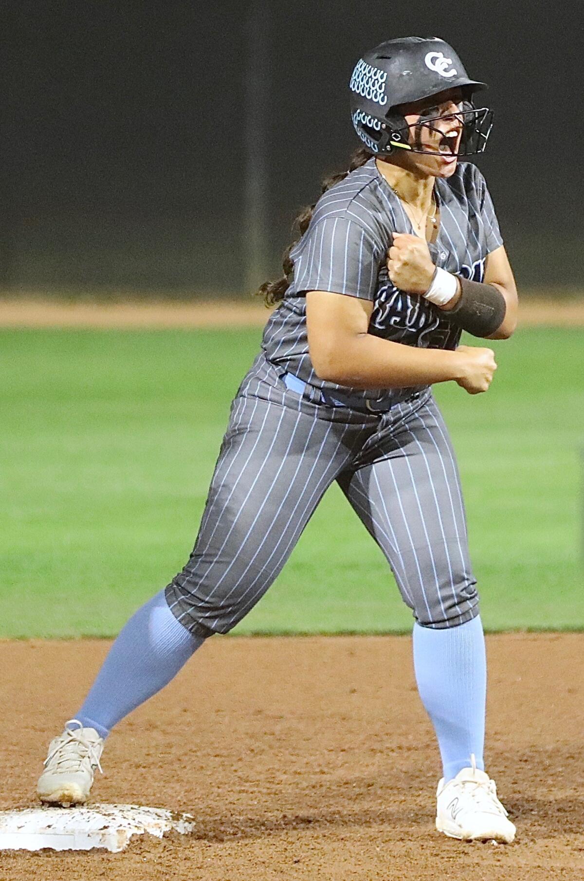 Carson's Alana Langford celebrates after a double for the game’s first hit in the seventh inning against Granada Hills.