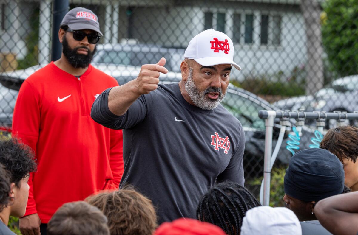 Mater Dei head coach Raul Lara coaches the team after a game with Upland in the Long Beach Millikan tournament.