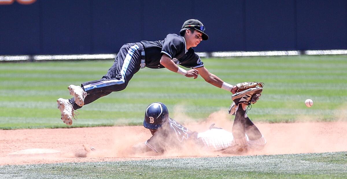 Birmingham's Sebastian Valadez slides safely into second base as Carson's Joziah Agredano can't reach the throw.