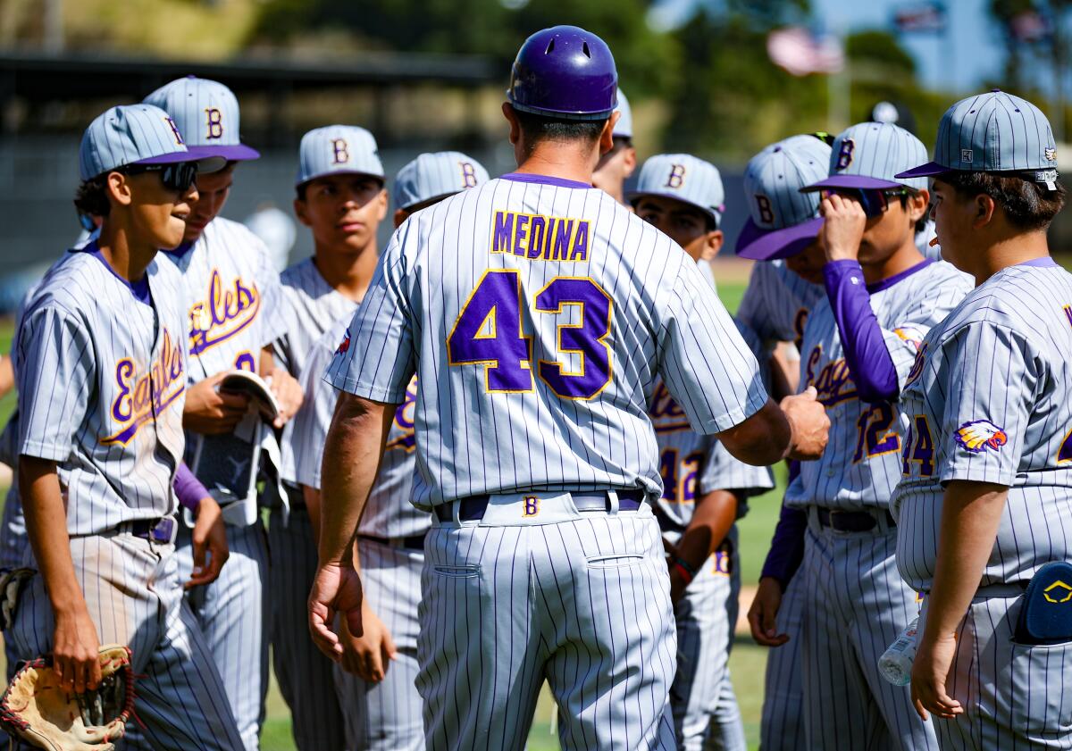 Bell coach Frank Medina talks to his players after semifinal win sends them on a trip to Dodger Stadium.