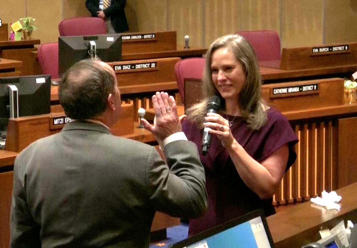 Arizona Supreme Court Justice Clint Bolick administering the oath of office to his wife, state 