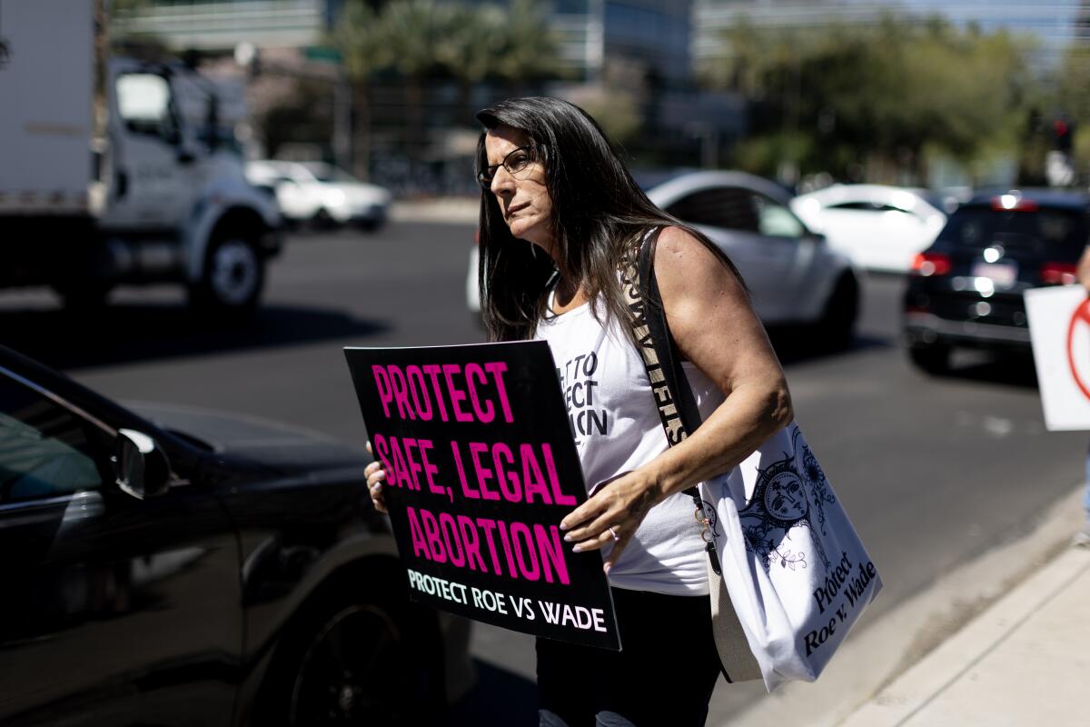 Nancy Gillenwater of Scottsdale joins other Arizona residents at a rally for abortion rights on 