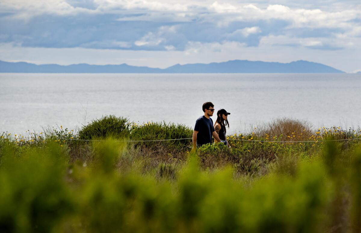 Day hikers enjoy the nature trail and sea air at Crystal Cove State Park