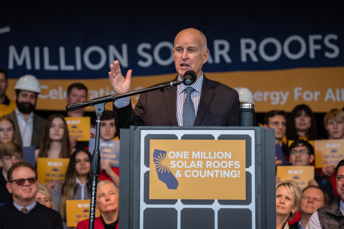 Jerry Brown speaks at a podium