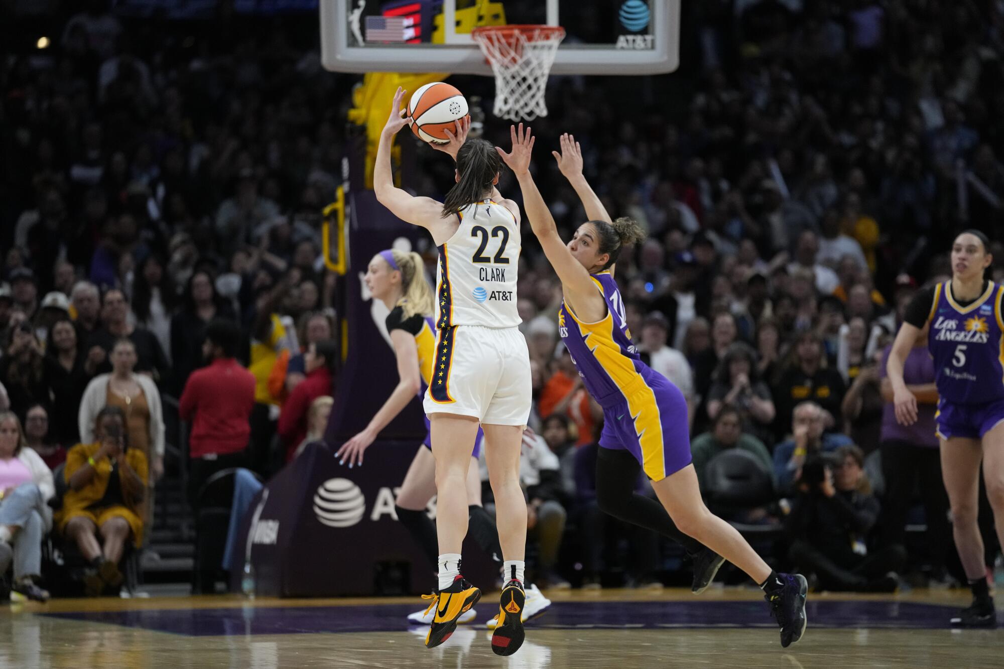 Indiana Fever guard Caitlin Clark makes a 3-pointer during the second half of a win over the Sparks Friday.