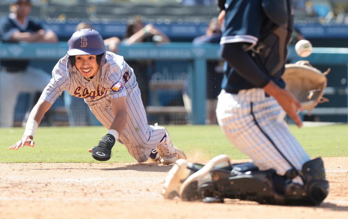 Bell's Jayden Barrientos scores the game's first run in the sixth inning of the City Section Open Division championship game.