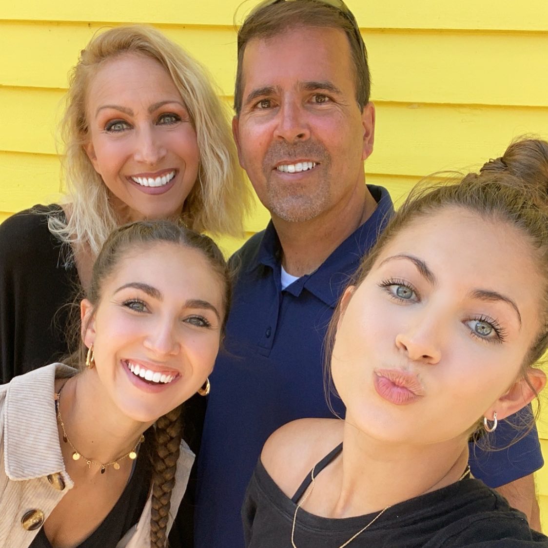 The sisters with mum Kelly and dad Dean