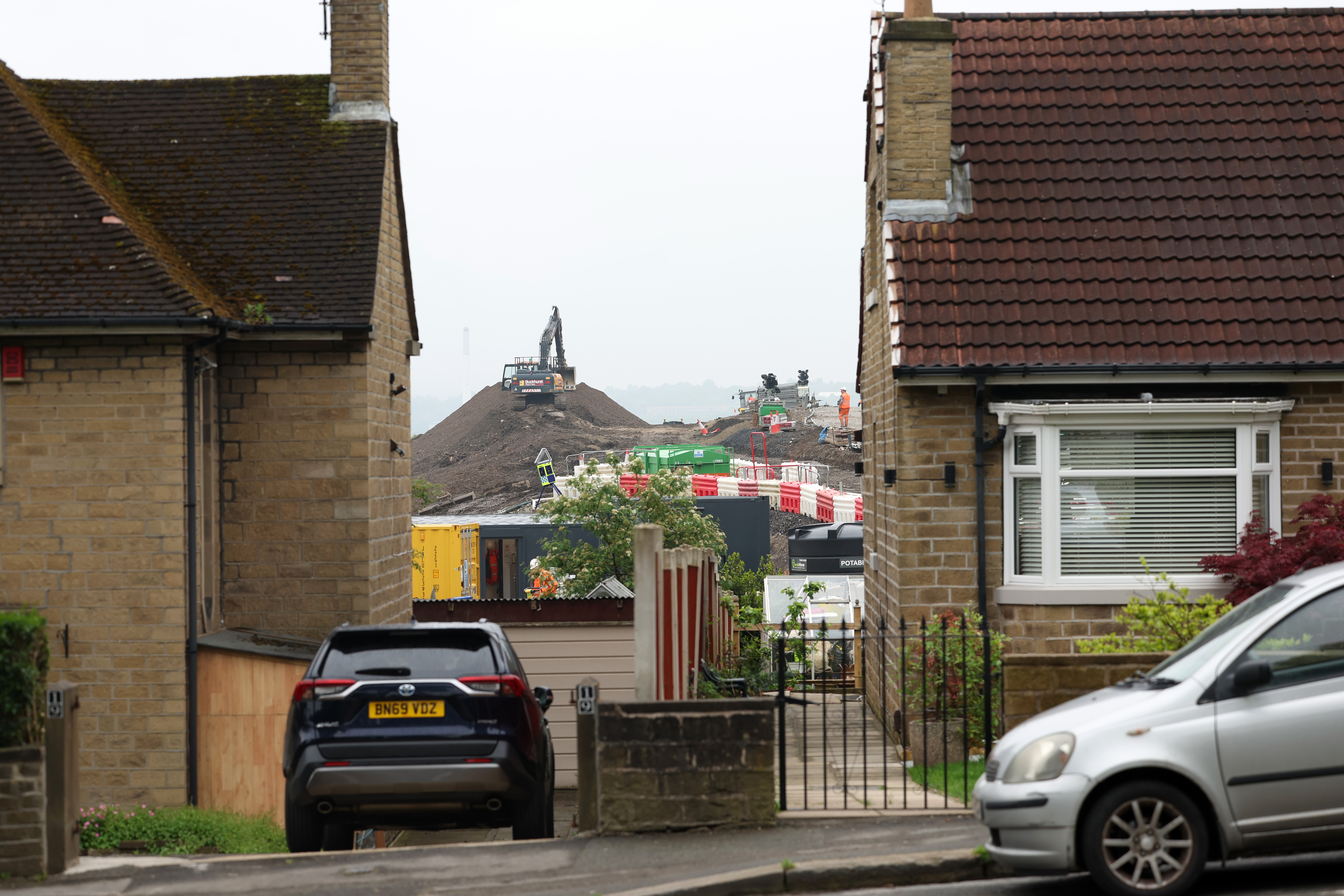 Householders in 14 terraced houses have signed a petition calling for workers to stay out of their gardens