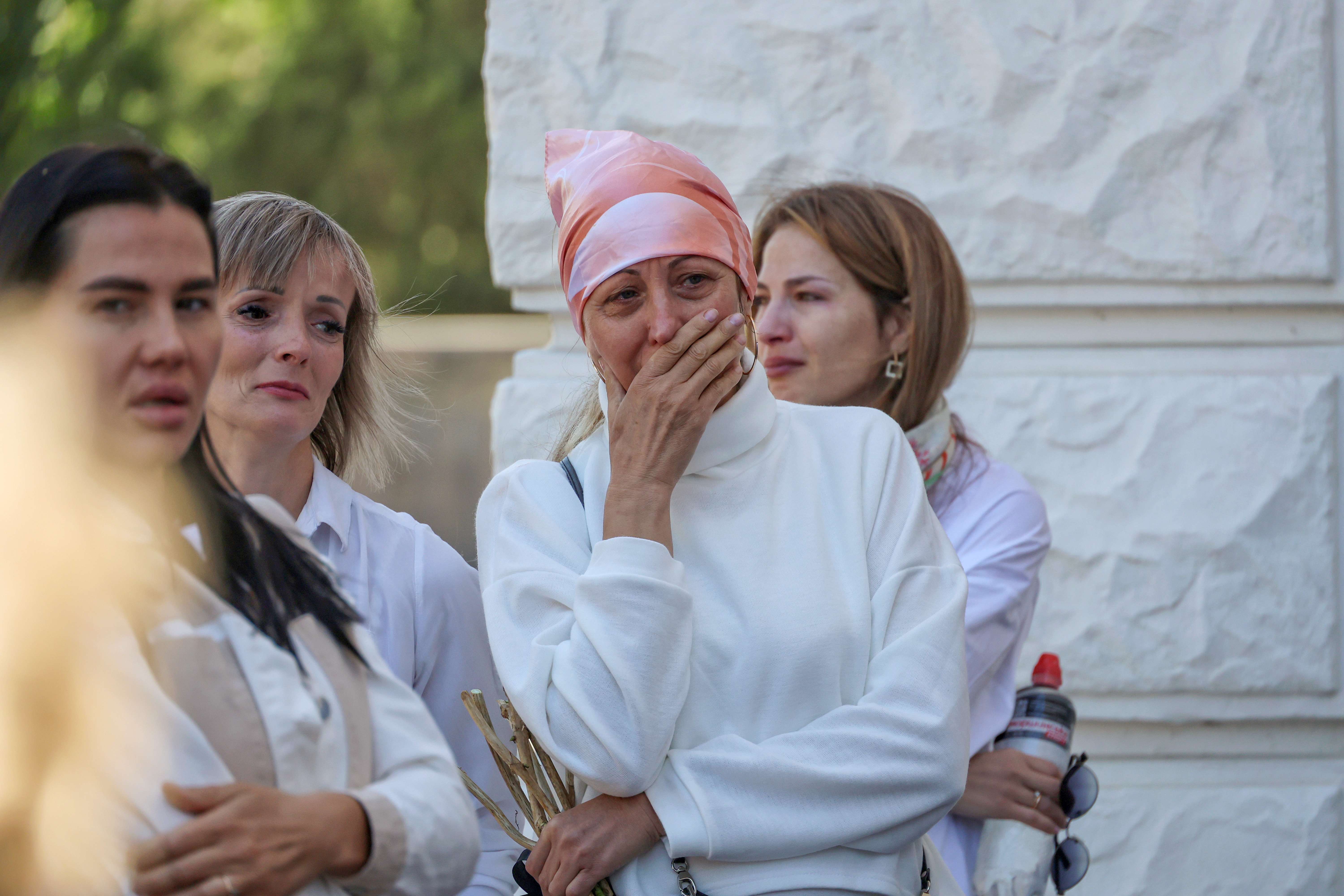 Other mourners cry at the funeral for brave Zlata