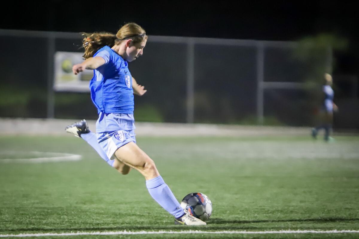 Mckenna Whitham kicks the ball during a training session