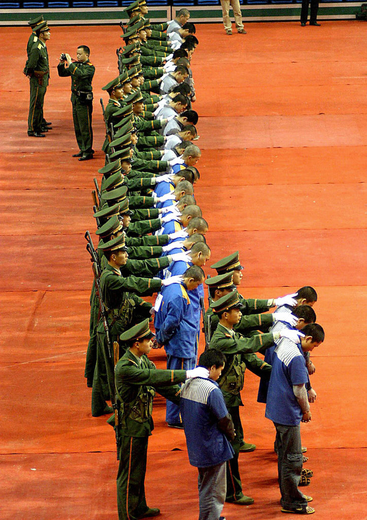 Convicts are shown at a sentencing rally in Wenzhou on April 7, 2004