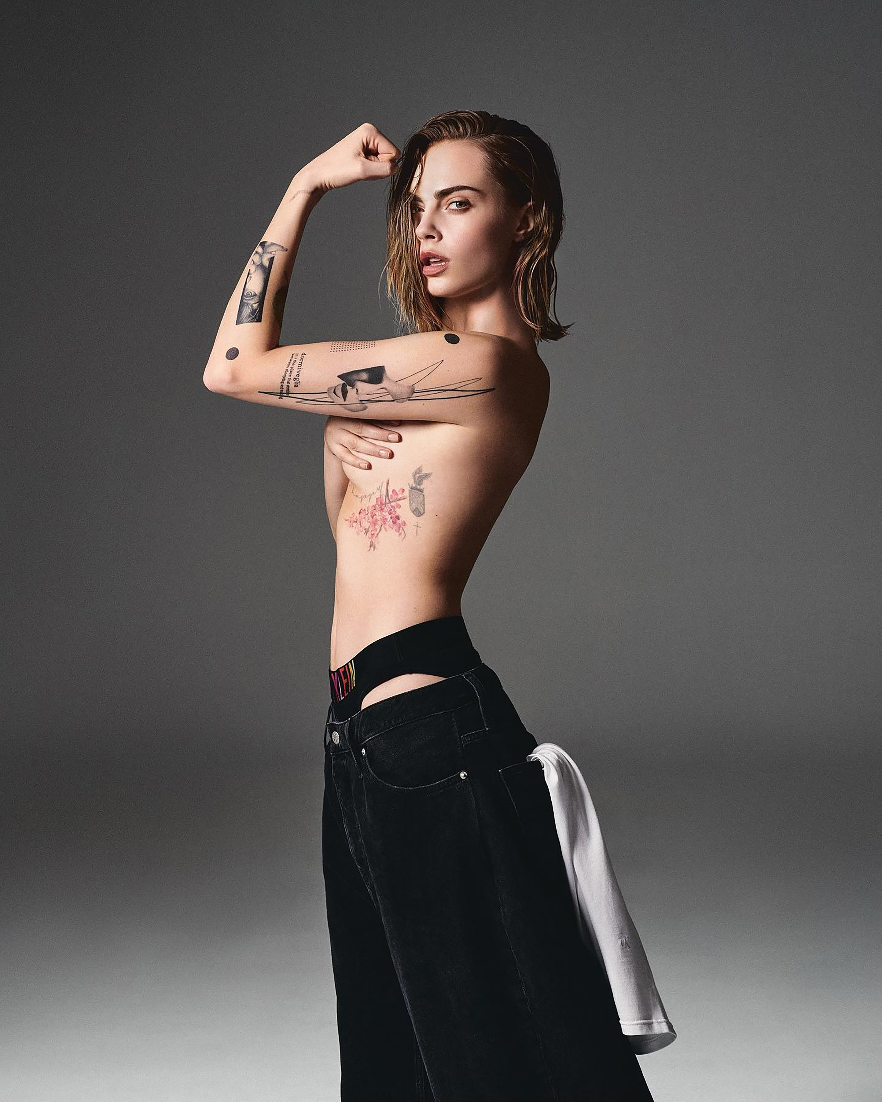 In another pic Cara flexed as she showed off her impressive tattoo collection