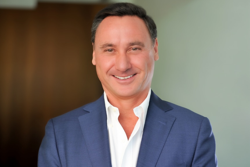 A headshot of a man in a business suit.  