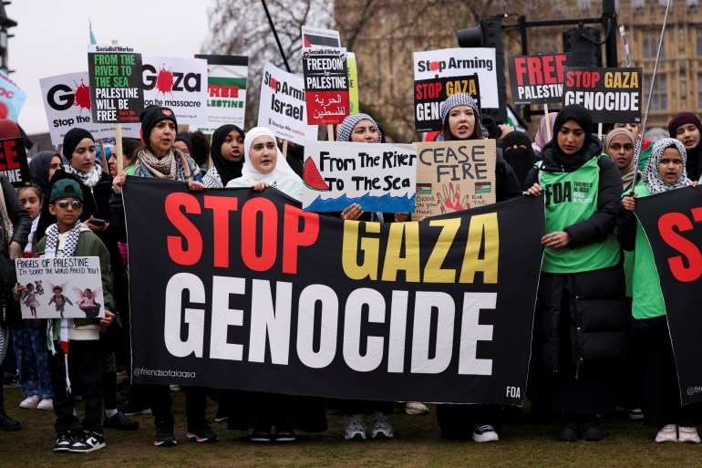 Protesters gather to attend a march in solidarity with Palestinians in Gaza