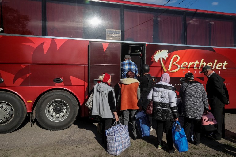 Residents from Vovchansk and nearby villages board a bus during an evacuation to Kharkiv due to Russian shelling, amid Russia's attack on Ukraine, at an undisclosed location near the town of Vovchansk in Kharkiv region, Ukraine May 10, 2024. REUTERS/Vyacheslav Madiyevskyy