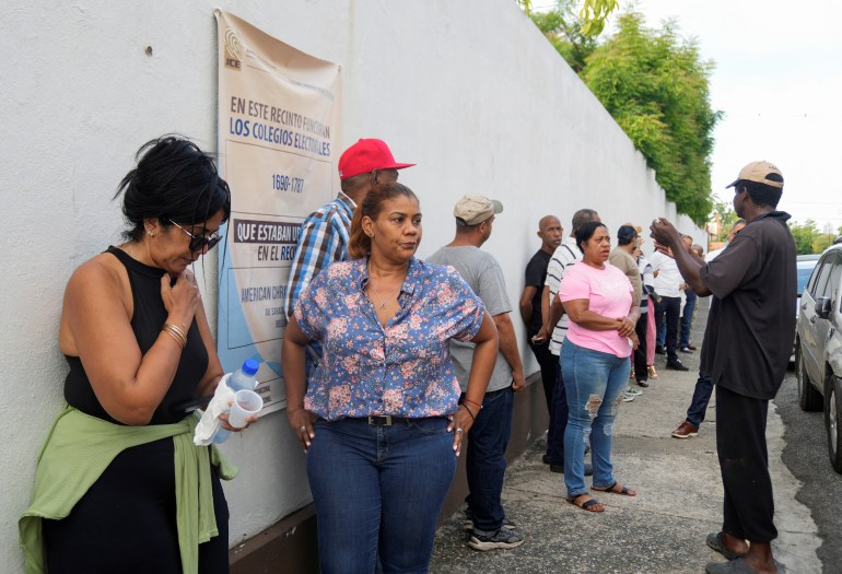 People line up to cast their votes in the Dominican Republic