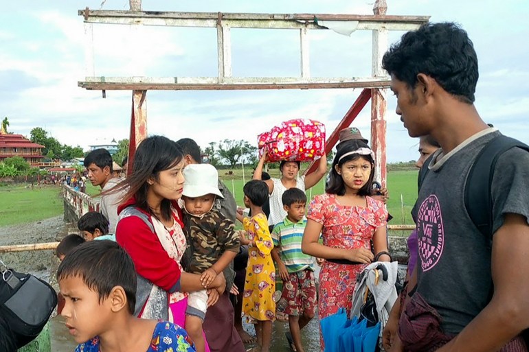A group of women and children fleeing their village amid renewed fighting between the AA and the Myanmar military