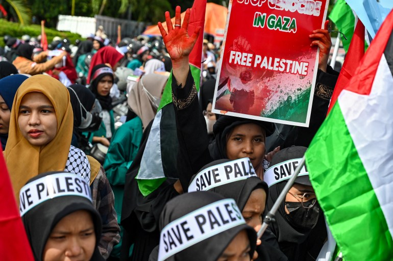 Pro-Palestinian activists take part in a protest against Israel's actions in Gaza, in Banda Aceh on May 18