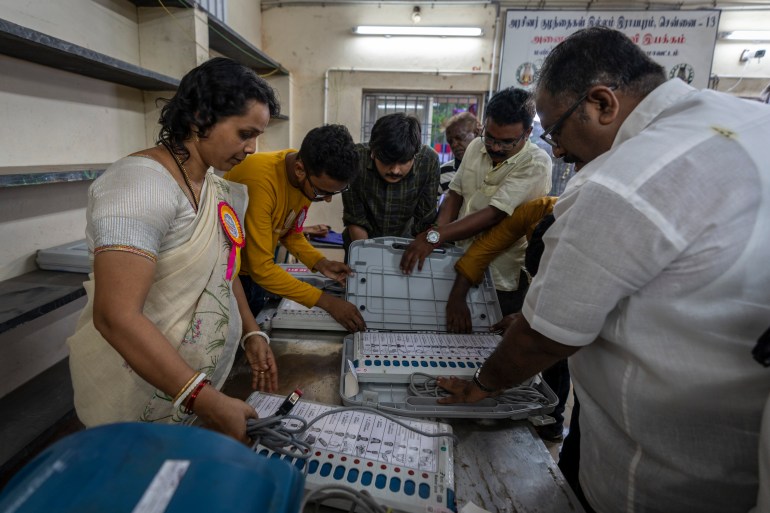 Election officials prepare to seal the Electronic Voting Machines (EVMs) as the voting ends at a polling station in Chennai, southern Tamil Nadu state, Friday, April 19, 2024. Nearly 970 million voters will elect 543 members for the lower house of Parliament for five years, during staggered elections that will run until June 1. (AP Photo/Altaf Qadri)